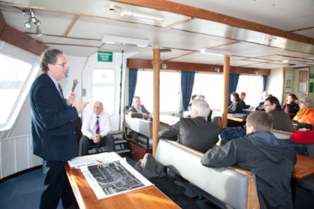 Keith Anderson, Chief Executive, Port of Leith Housing Association presents on board the Edinburgh waterfront boat trip